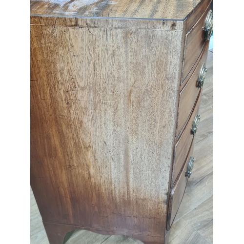 592 - A late Georgian mahogany bow front Chest of four long drawers on splay feet