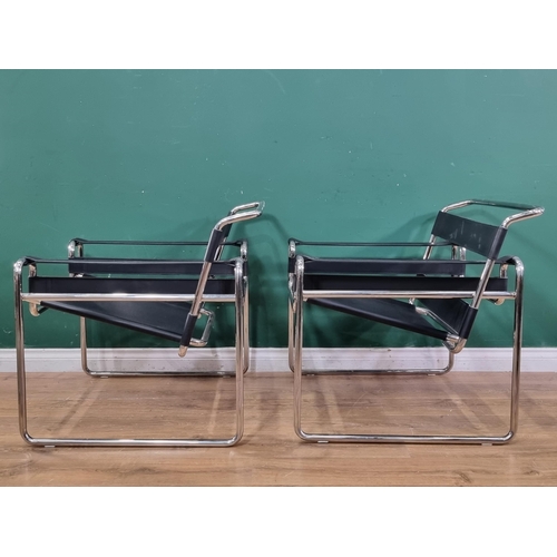 598 - A pair of Le Corbusier style low Armchairs