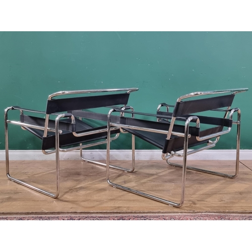 598 - A pair of Le Corbusier style low Armchairs