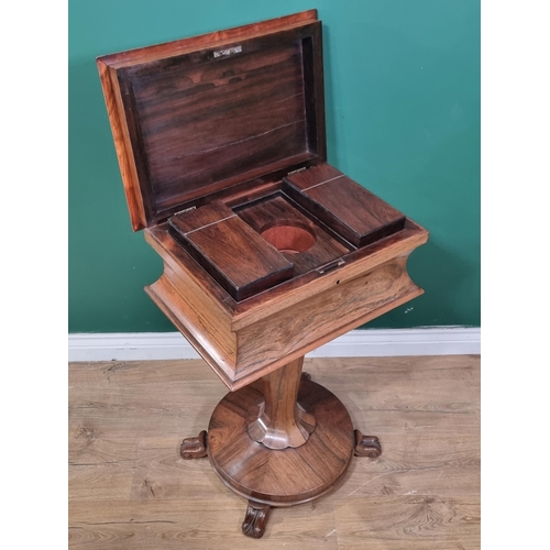 617 - An early 19th Century rosewood Teapoy of sarcophagus shape having two interior lidded compartments o... 