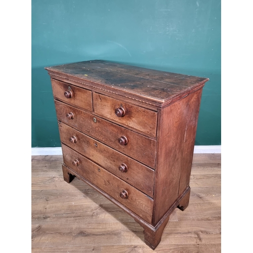 624 - A Georgian oak Chest of two short above three long drawers with satinwood and ebony stringing raised... 