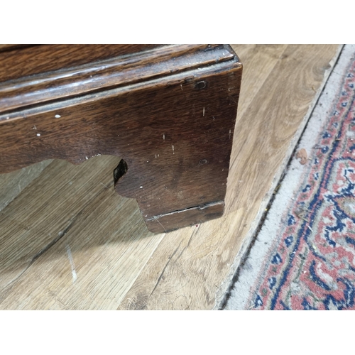 624 - A Georgian oak Chest of two short above three long drawers with satinwood and ebony stringing raised... 