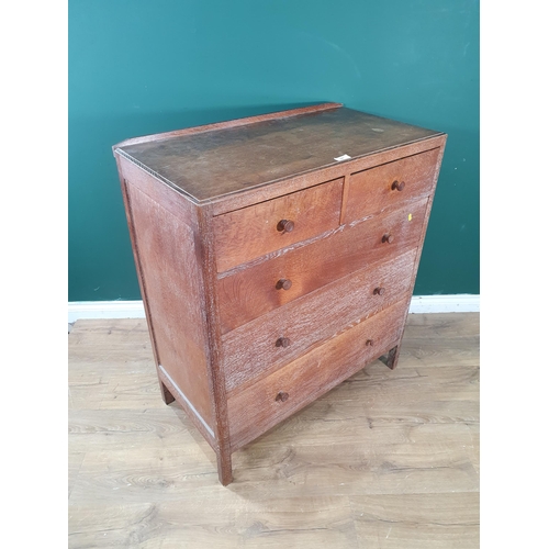 627 - A Heal's oak Chest of two short over three long graduated Drawers, with panelled sides and back, rai... 