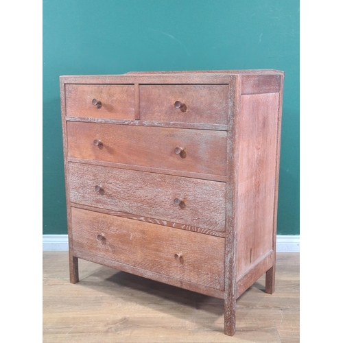 627 - A Heal's oak Chest of two short over three long graduated Drawers, with panelled sides and back, rai... 