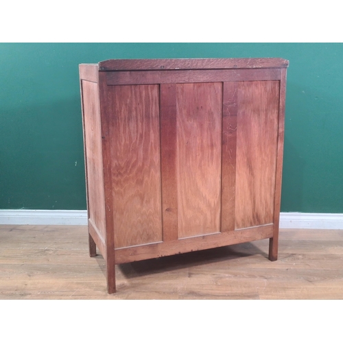 627 - A Heal's oak Chest of two short over three long graduated Drawers, with panelled sides and back, rai... 