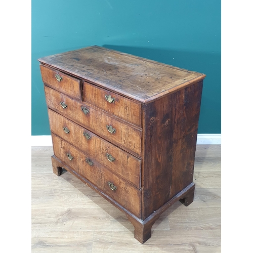 637 - An 18th Century walnut veneered and crossbanded Chest of two short and three long graduated drawers ... 