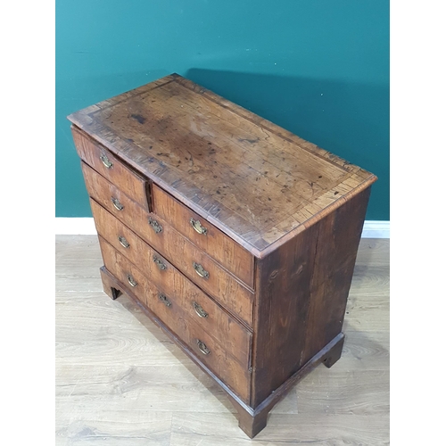 637 - An 18th Century walnut veneered and crossbanded Chest of two short and three long graduated drawers ... 