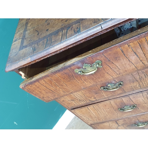 637 - An 18th Century walnut veneered and crossbanded Chest of two short and three long graduated drawers ... 