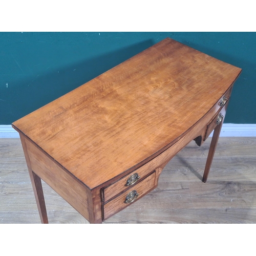 639 - A George III satinwood bow front Side Table fitted one long and two short drawers on square tapering... 