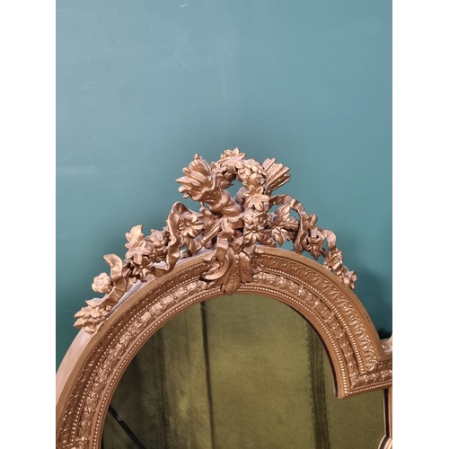 640 - A 19th Century gilt framed Wall Mirror with torch and floral surmount, 4ft high