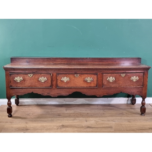 644 - An 18th Century oak Derbyshire Dresser Base with raised back, fitted three frieze drawers on baluste... 