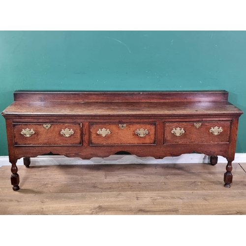 644 - An 18th Century oak Derbyshire Dresser Base with raised back, fitted three frieze drawers on baluste... 