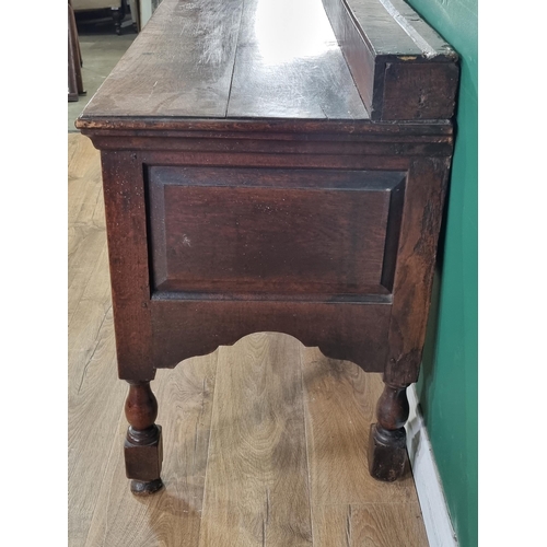 644 - An 18th Century oak Derbyshire Dresser Base with raised back, fitted three frieze drawers on baluste... 