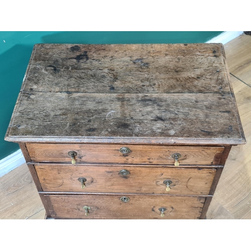 647 - An 18th Century oak Chest of three long drawers with satinwood stringing raised on bracket feet 2ft ... 