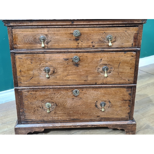 647 - An 18th Century oak Chest of three long drawers with satinwood stringing raised on bracket feet 2ft ... 