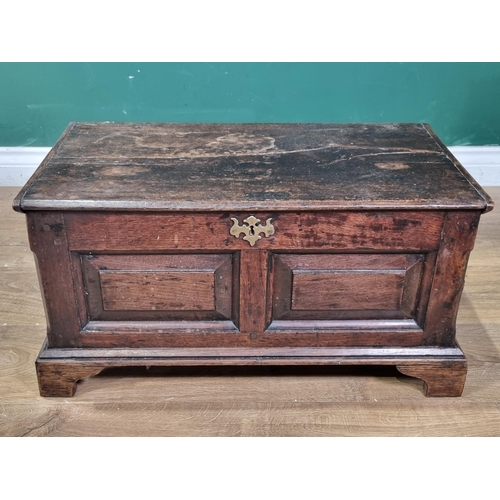 655 - An 18th Century and later oak Coffer Bach, the hinged lid above panelled front, raised on later brac... 