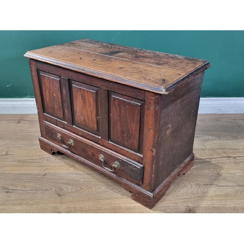 657 - An 18th Century oak and elm Coffer Bach, the moulded top above three fielded panels, with single fit... 