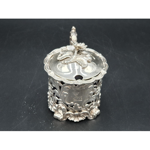 70 - A William IV large silver pierced circular Mustard Pot with floral and scroll embossing, engraved cr... 