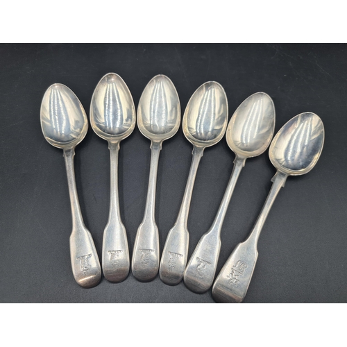 76 - Six 19th Century silver Dessert Spoons fiddle pattern engraved crests, various dates, 255gms