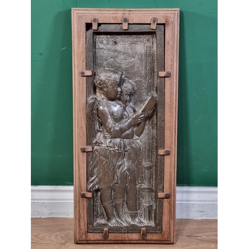 786 - A cast bronze relief Plaque/Panel, depicting standing winged Angels reading a Book, mounted in a mou... 