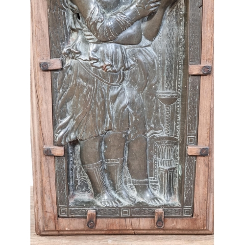 786 - A cast bronze relief Plaque/Panel, depicting standing winged Angels reading a Book, mounted in a mou... 