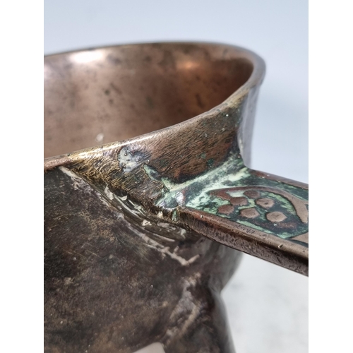 794 - An antique bronze Skillet on wedge shaped supports, the handle bearing the name 