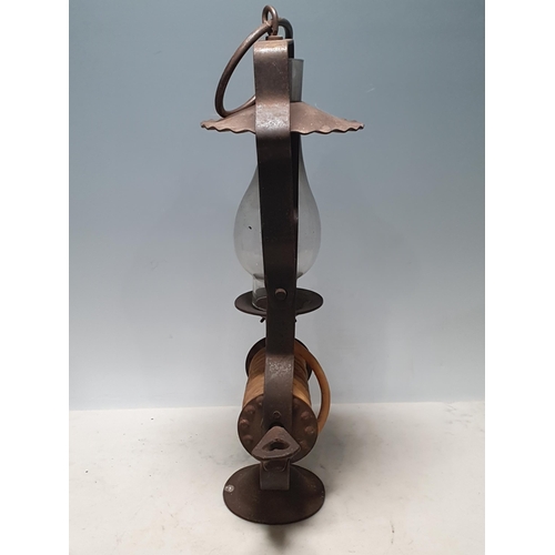 803 - A wrought iron Wax Jack Lamp with swing handle, with glass flue on circular base, 14in H