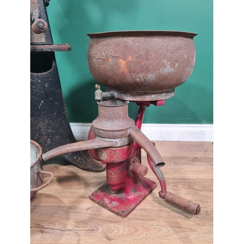 809 - A floor standing, black painted cast iron Cream Separator with tin pans, along with a small red pain... 