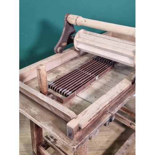 811 - A table top Butter Worker, possibly sycamore, with ironwork marked R.A. Lister, on wooden stand, 3ft... 