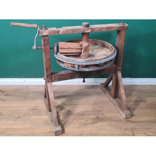 818 - A circular floor standing Butter Worker with metal toothed fittings, 3ft 3in H, 3ft Diameter