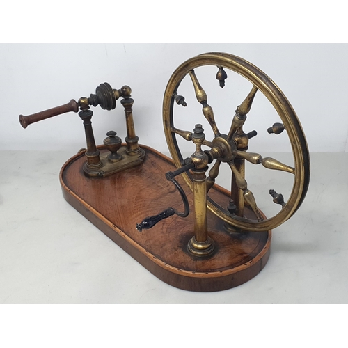 824 - A 19th Century mahogany Wool Winder with brass wheel and handle 9in H and an antique Crimper