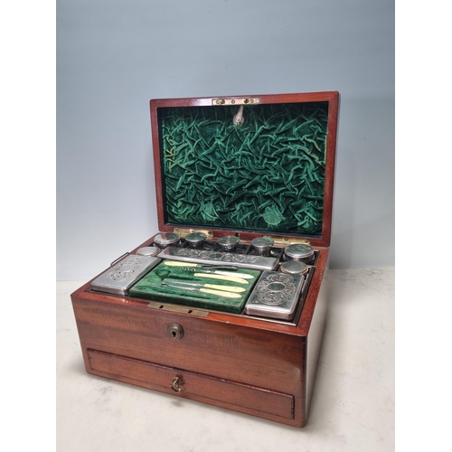 833 - A 19th Century Dressing Box containing silver and plated covered glass boxes and jars, fitted drawer... 