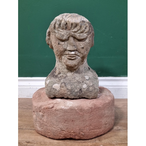 841 - A carved Limestone Bust of a Gentleman (Possibly Medieval) raised on associated Mill Stone base. 15