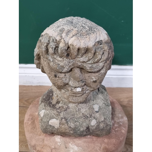 841 - A carved Limestone Bust of a Gentleman (Possibly Medieval) raised on associated Mill Stone base. 15