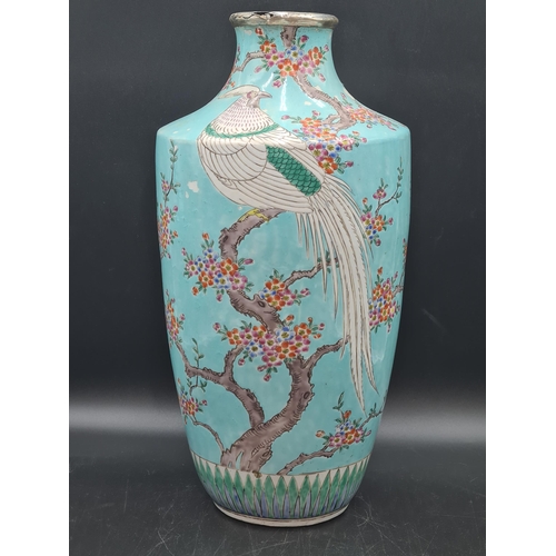 852 - A Chinese turquoise ground Vase painted exotic bird and flowering shrubs in colours, 17in, later sil... 