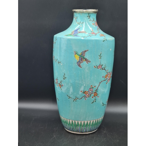 852 - A Chinese turquoise ground Vase painted exotic bird and flowering shrubs in colours, 17in, later sil... 