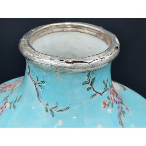 852 - A Chinese turquoise ground Vase painted exotic bird and flowering shrubs in colours, 17in, later sil... 