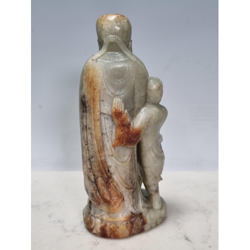 854 - A Chinese Qing Dynasty Jade figure group of Sage standing on clouds, A/F, 6.5