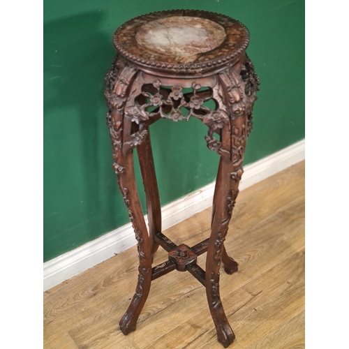 860 - A Chinese hardwood Jardiniere Stand with inset marble top surrounded by a beaded edge, the shaped su... 