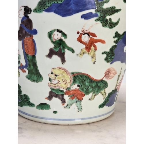 867 - **** AMENDMENT **** A Chinese Wucai baluster Vase, Qing Dynasty, depicting boys at play in a garden ... 