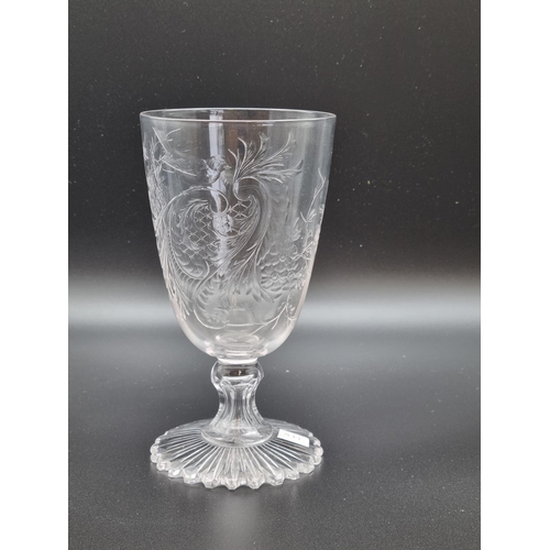 870 - An antique intaglio cut-glass wine with scroll, leafage and bird decorated conical bowl, on short st... 