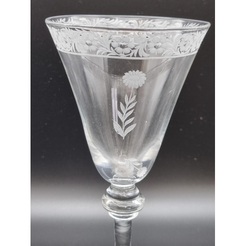 874 - A Newcastle light baluster Trick Wine Glass, the trumpet, shaded bowl engraved band of flowers and s... 