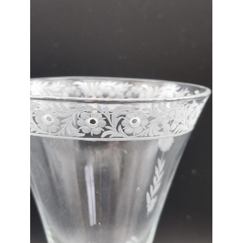 874 - A Newcastle light baluster Trick Wine Glass, the trumpet, shaded bowl engraved band of flowers and s... 