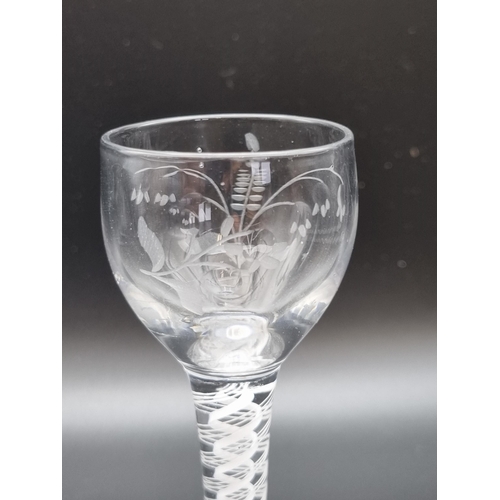 875 - An engraved Cordial Glass, baluster bowl with engraved branch and foliage design on a double white o... 