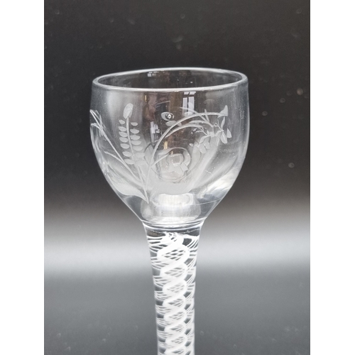 875 - An engraved Cordial Glass, baluster bowl with engraved branch and foliage design on a double white o... 