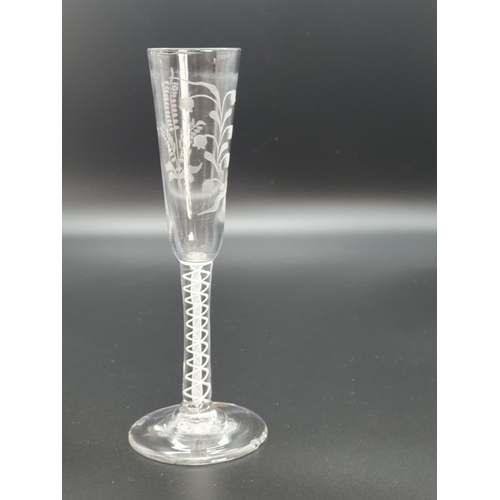 888 - A double opaque twist stem ratafia glass with slender flute engraved floral and leaf sprigs, base ch... 