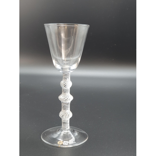 891 - A balustroid wine glass with air twist stem, triple knop with plain bucket bowl 6 3/4in H