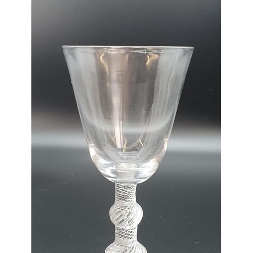 891 - A balustroid wine glass with air twist stem, triple knop with plain bucket bowl 6 3/4in H