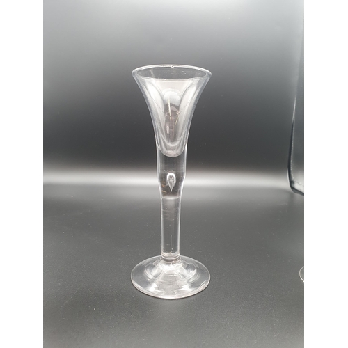 898 - A wine with trumpet bowl, tear drop stem, a small wine with fluted and floral engraved on baluster f... 