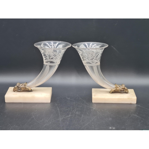 900 - A pair of etched glass Cornucopia on gilt metal ram's head and white marble bases, chipped